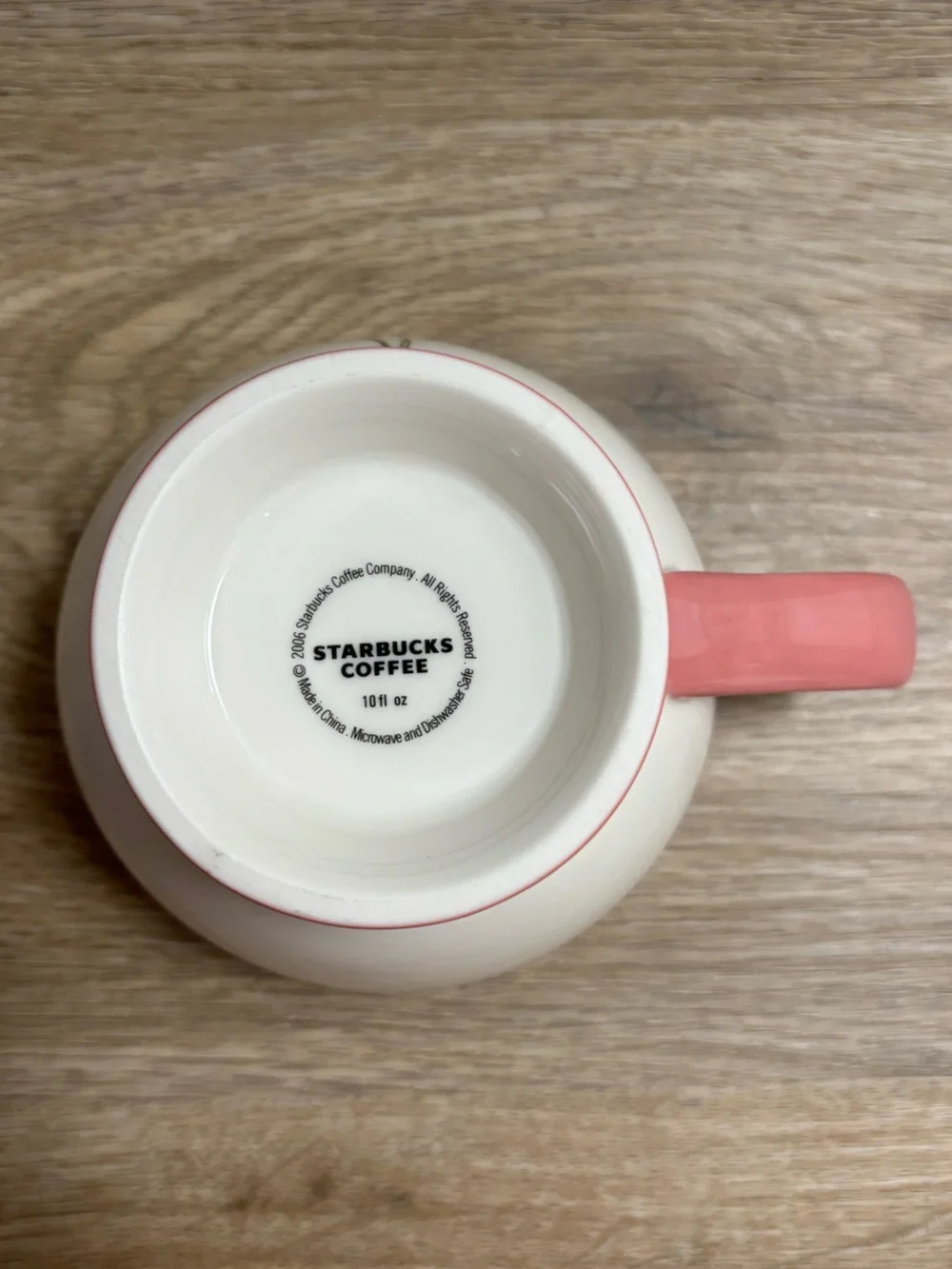 Starbucks Cream Ceramic Teacup with Pink Trim and Floral Motif